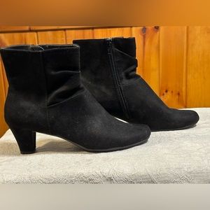 Black suede soft heeled boot.
